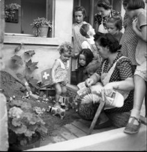 Riex; Women and children with lanterns; 1955