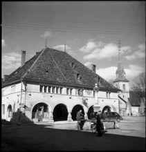 Val de Travers, village square, fountain, community center in Môtiers; 1950