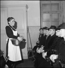 Power outage, women in emergency kitchen; 1943
