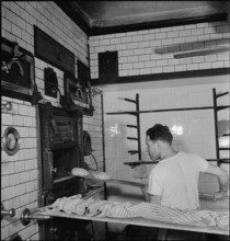 Baker in the bakery, oven; 1943