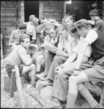 Young men reading a newspaper, 1944