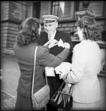 Woman arranging a man's handkerchief, Winterthur 1949