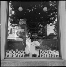 Product advertising, CocaCola advertising in shop windows; 1952