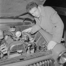Inventor with gaspowered car, 1956