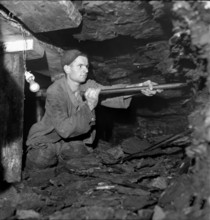 Miners in the gallery; coal mine Mörschwil; 1944.