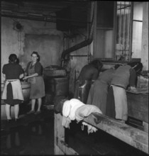 Refugees; women working in the laundry; 1945.