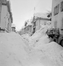 Airolo 1951, snow covered deserted  lane.