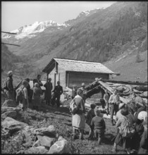 Farmers meet for cheese donation in the Turtmanntal valley, Switzerland, 1940.
