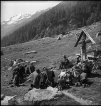 Farmers praying in the Turtmanntal valley, Switzerland, 1940.