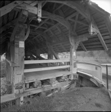 Langnau Jlfis, wooden roofed bridge after being moved; 1964.