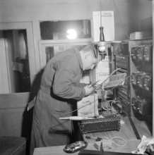 Davos: Electrician inspects electrical installations; 1949.