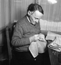 Woman embroidering, 1941.
