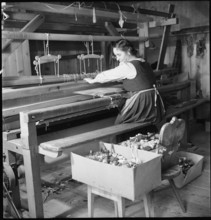Woman working in weaving mill in the Münstertal, 1946.