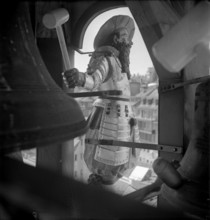 Fribourg; mecanic striker at turret clock on the city hall; 1953.