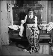 Woman spinning in weaving mill in the Münstertal, 1946.