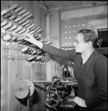 Embroideress working, 1945.