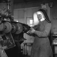 Sister Hugo, Switzerland's  first shoemaker at work; 1944.
