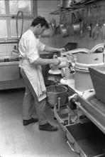 Berne, examinee running a kneading machine; 1970.