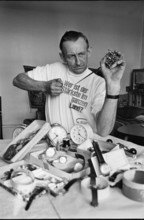 Chrampf-Olympiade; Man reparing alarm clock 1969.