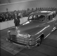 Auctioneer auctions Chrysler; 1955.