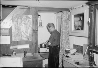 Man cooking in artists home Riesbach, Zürich 1950.