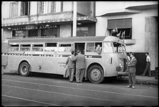 The Swiss being picked up by a Scandinavian Airlines bus in front of restaurant Atalaia.