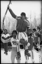 Olympic games Lake Placid 1980, downhill: Podborski and Wirnsberger carrying winner Stock on their