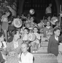 Children holding Chinese lantern celebrating the national holiday; 1952.