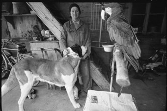 Man with dog and parrot in the Emmental, 1970.