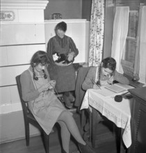Home scene with girls and aged woman 1950.