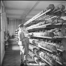 Stock of bread for the army; gymnasium turned into warehouse; 1939.