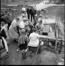 People enjoy Zurzach thermal spring; 1955.