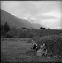 Valais, Grône, woman with goat in front of a coal mine; 1957.