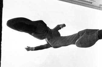 Man standing on glass, photographed from underneath, 1969.