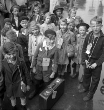 Children from the American, the British and the Russian zone of Berlin arrive at the station.