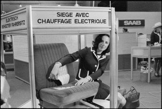 hostess presents an electrically heated seat.