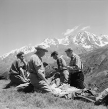 Farmers resting in the meadow, 1955.