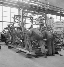Factory workers, assembly hangar; General Motors 1946.