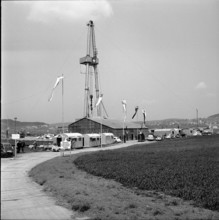Zumikon, drilling derrick decorated with flags; 1960.