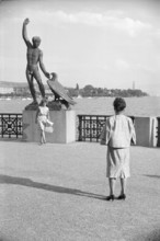 Tourists at Ganymed statue in Zurich, 1962.