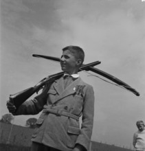 Boy shooting with the crossbow, 1944.