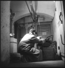 Spy transmitting a message; 1946.