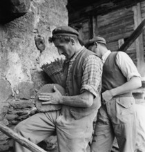 Valais farmers with freshly baked bread, 1941.