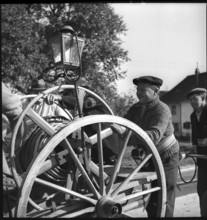 War fire brigade: men with hose cart, 1939.