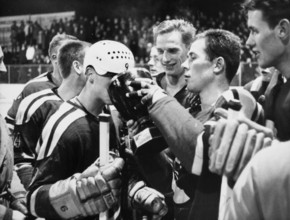Swiss Ice hockey cup 1964/65: winner SC Bern, goalie Kiener passing cup to Schmidt.