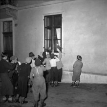 Children celebrating the end of the school semester in 1950.