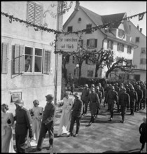 Soldiers' wedding; three wedding couples passing through village; 1941.