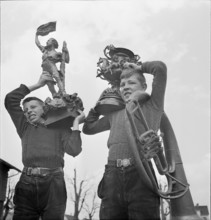 Boys collecting articles of non-ferrous metal; 1940.