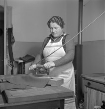Tailoring of uniforms; iron, 1939.