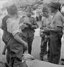 Soldiers receiving food; 1939.